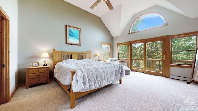 bedroom featuring ceiling fan, baseboard heating, light carpet, and multiple windows