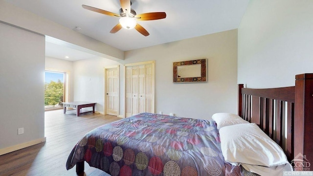 bedroom featuring hardwood / wood-style floors and ceiling fan