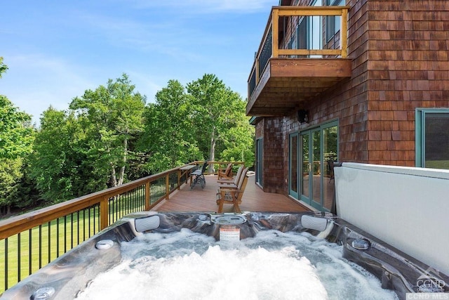 deck with a hot tub