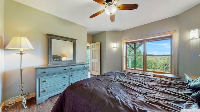 bedroom featuring hardwood / wood-style flooring and ceiling fan