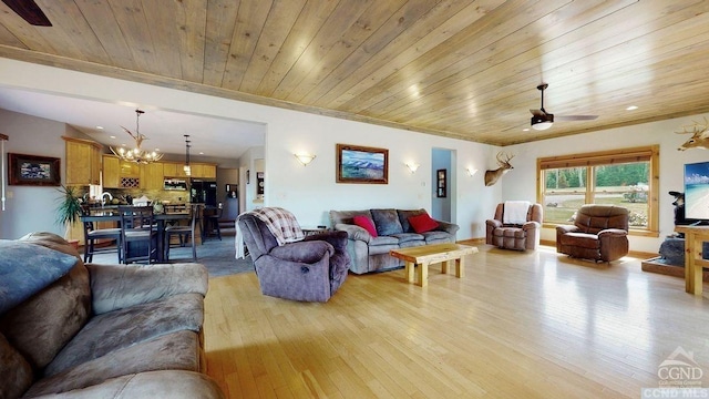 living room featuring ceiling fan with notable chandelier, light hardwood / wood-style floors, crown molding, and wooden ceiling