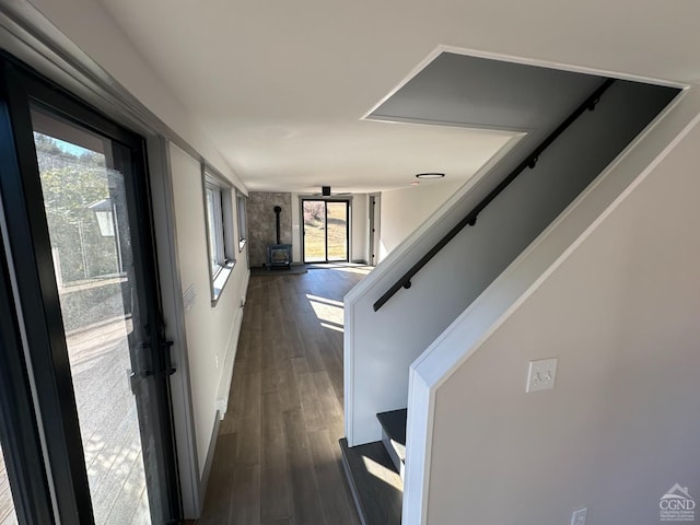 hall featuring dark wood-type flooring and stairway