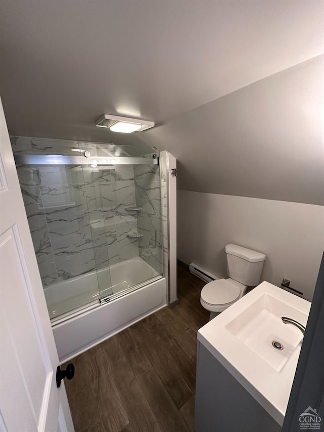 bathroom featuring lofted ceiling, toilet, enclosed tub / shower combo, wood finished floors, and baseboard heating