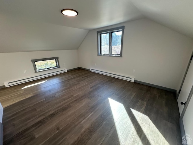 bonus room with dark wood-style floors, vaulted ceiling, baseboards, and baseboard heating