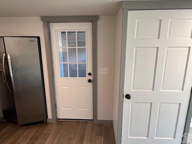 entryway with wood finished floors