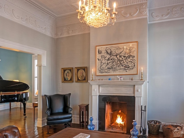 517519 Washington St, Hudson, NY 12534 - sitting room with a lit fireplace, wood finished floors, an ornate ceiling, and baseboards