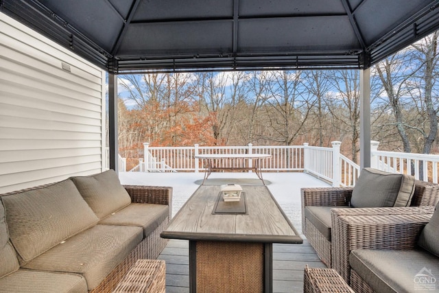 wooden deck with a gazebo and outdoor lounge area