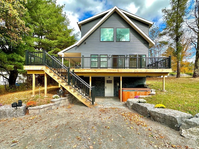 view of front of property featuring a deck and a hot tub