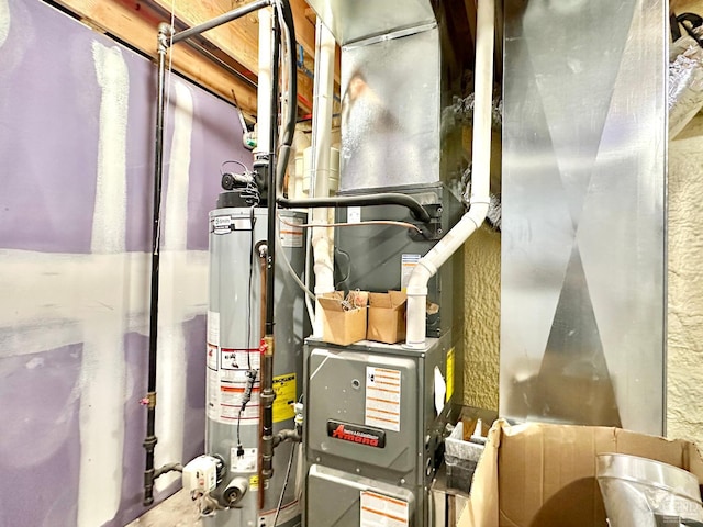 utility room featuring gas water heater