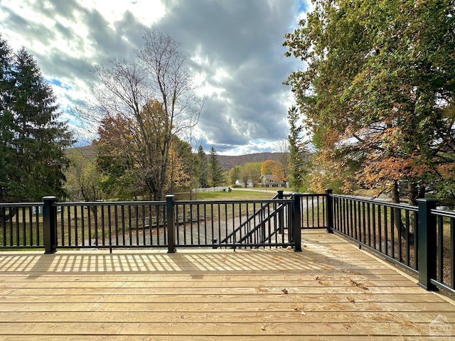 wooden terrace featuring a mountain view