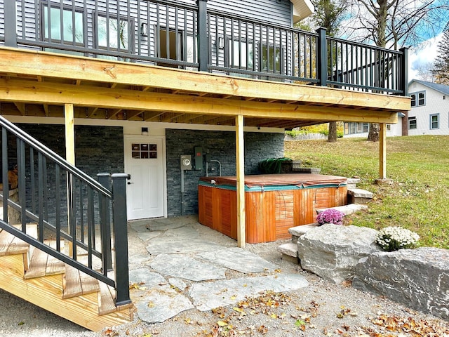 view of patio featuring a hot tub and a wooden deck