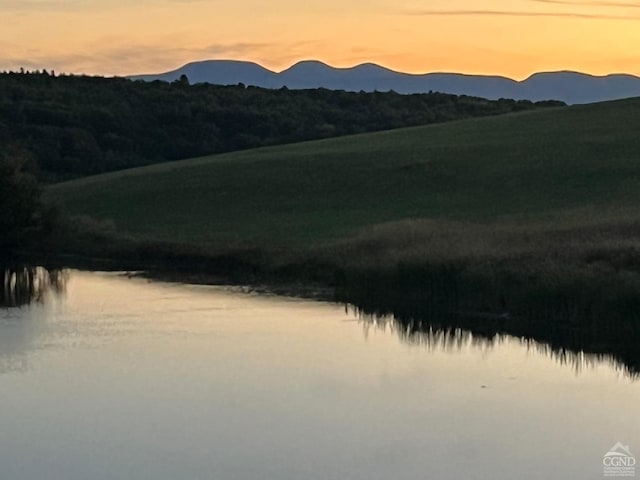 mountain view with a water view