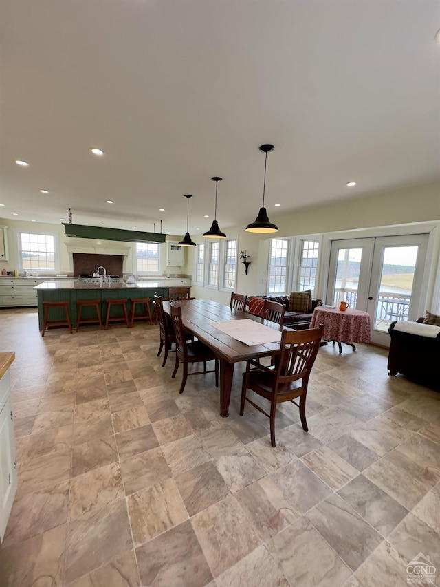 dining space featuring french doors, recessed lighting, and a wealth of natural light