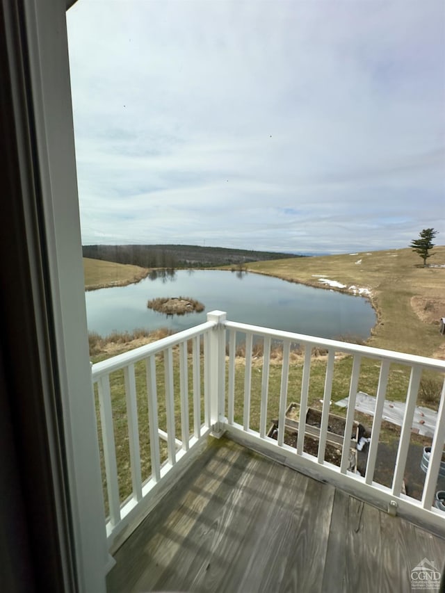 balcony featuring a water view