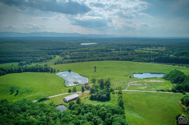 drone / aerial view with a rural view and a water view