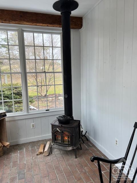 details with baseboards and a wood stove