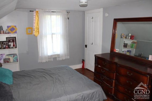 bedroom with vaulted ceiling