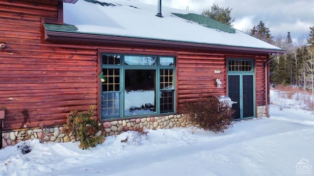 view of snow covered property