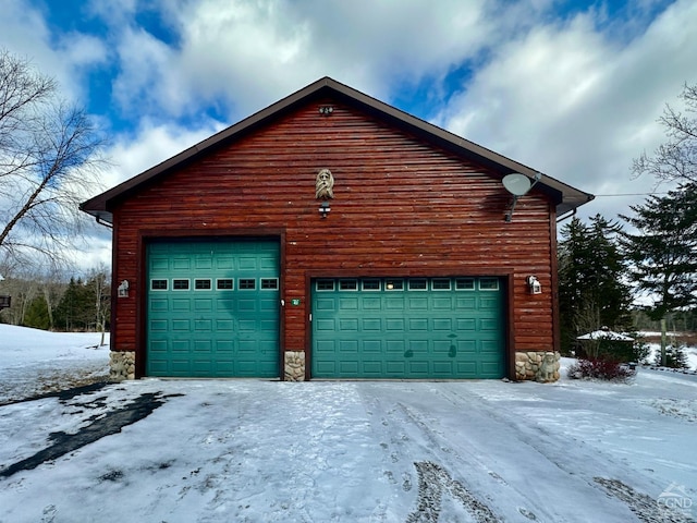 view of snow covered garage