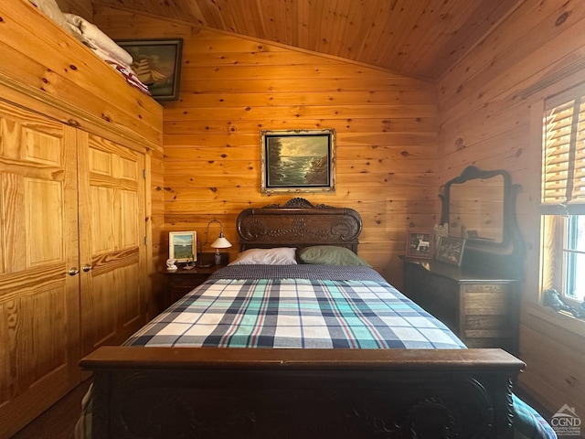 bedroom featuring wood walls, wood ceiling, and vaulted ceiling