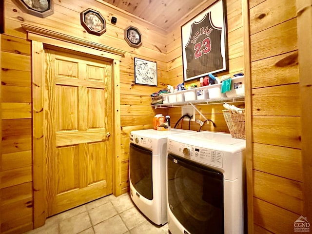 laundry room with separate washer and dryer, light tile patterned floors, wood walls, and wooden ceiling