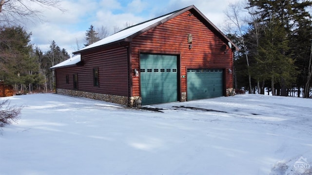 view of snow covered garage