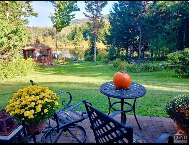 exterior space featuring a water view and a gazebo