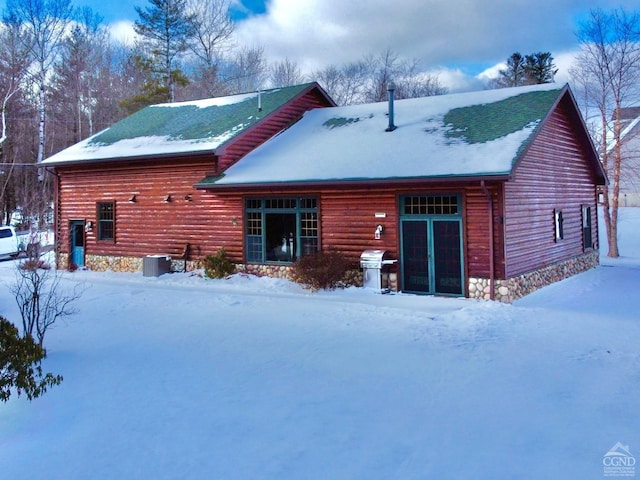 view of snow covered house