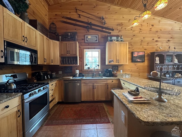 kitchen with wooden ceiling, pendant lighting, stainless steel appliances, and wooden walls