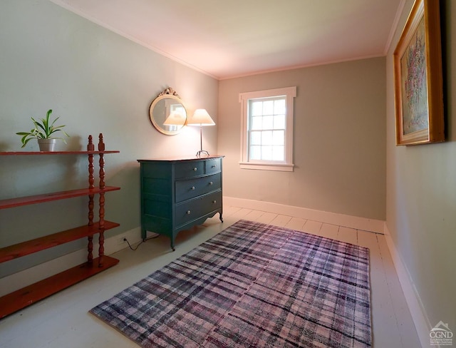 bedroom with light wood-type flooring and crown molding