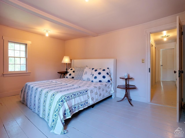 bedroom featuring wood-type flooring