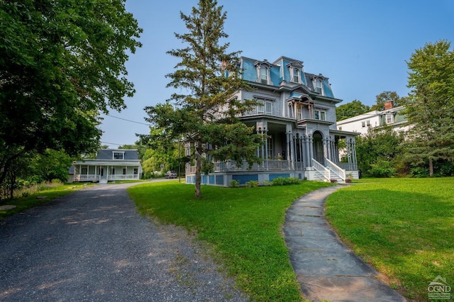 view of front of home featuring a porch and a front yard