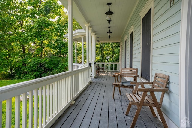 wooden terrace featuring a porch