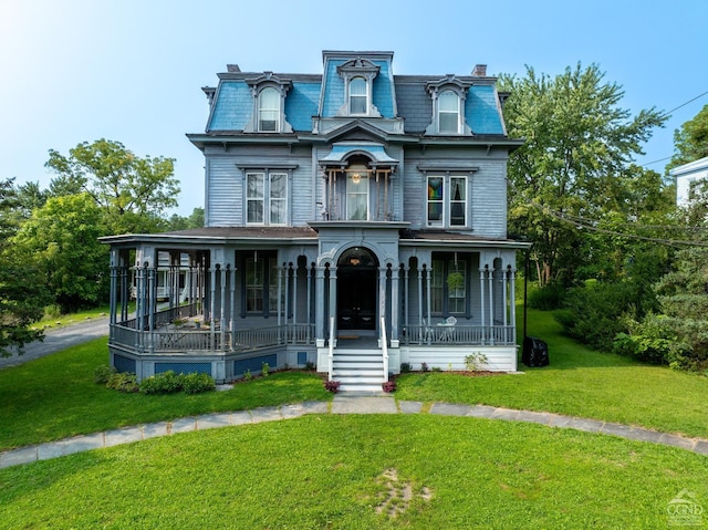 view of front of property with a front lawn and a porch