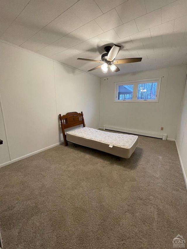 carpeted bedroom with ceiling fan, baseboards, and a baseboard radiator
