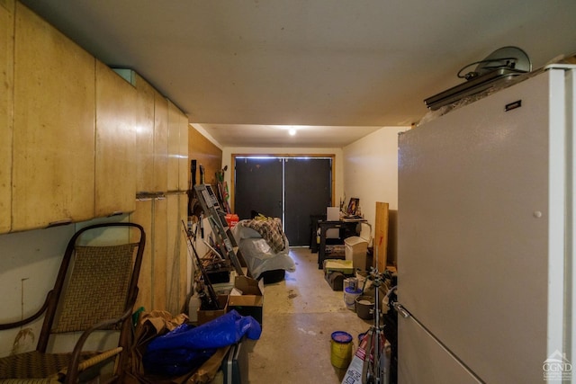 basement featuring white refrigerator