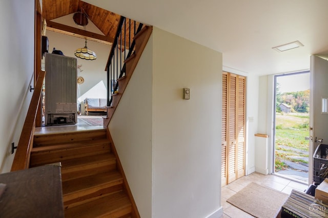 staircase with tile patterned flooring