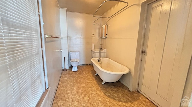 bathroom with shower with separate bathtub, toilet, and tile walls