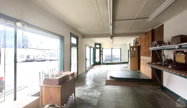 interior space featuring concrete flooring and a healthy amount of sunlight