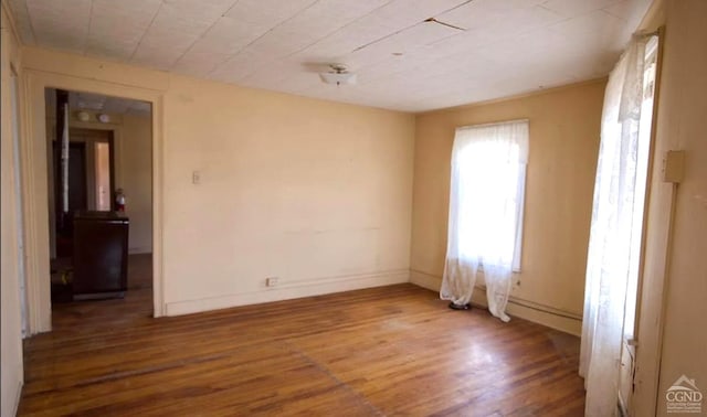 spare room with hardwood / wood-style floors