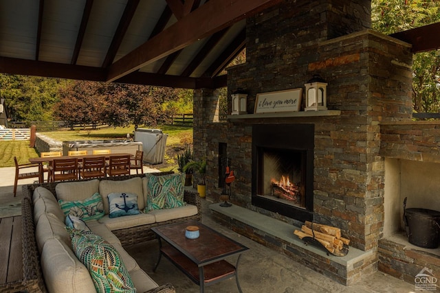 view of patio / terrace with a gazebo and an outdoor living space with a fireplace