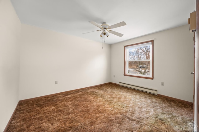 carpeted spare room featuring baseboard heating, a ceiling fan, and baseboards