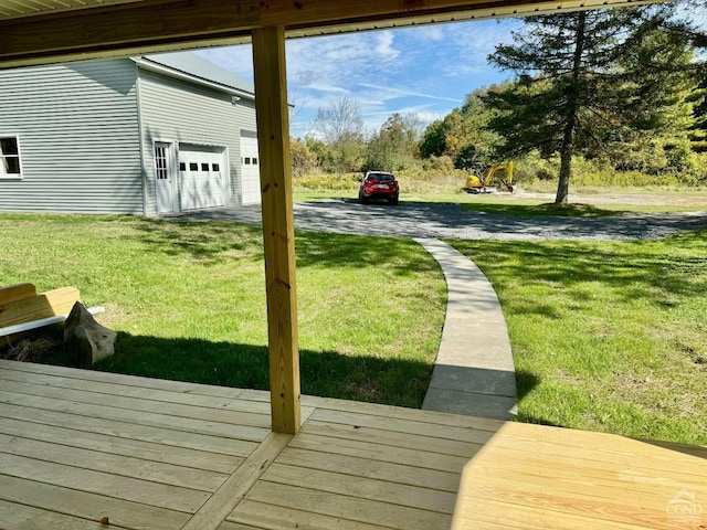 exterior space featuring a garage and a wooden deck