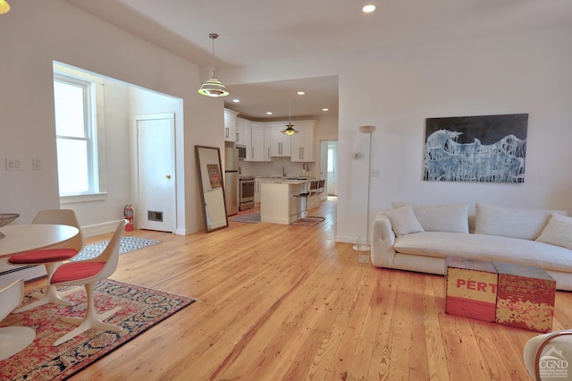 living room with light hardwood / wood-style flooring