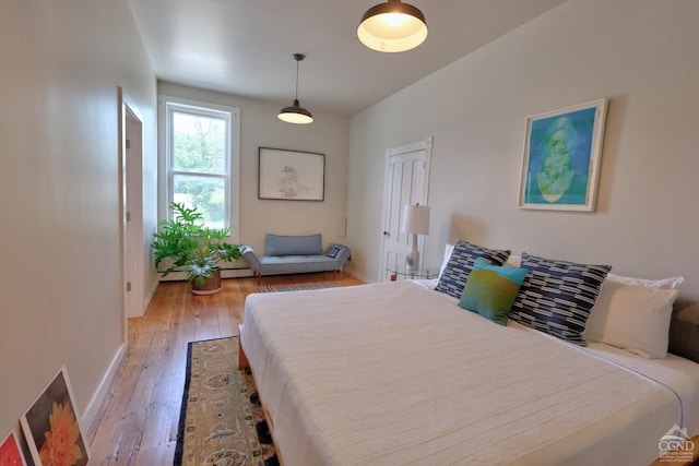 bedroom with light wood-type flooring