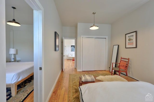 bedroom with a closet and light wood-type flooring