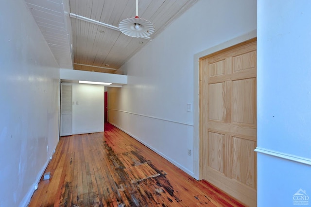 corridor featuring wood ceiling and wood-type flooring