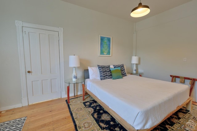 bedroom featuring wood-type flooring