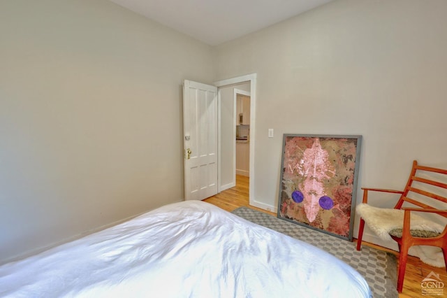 bedroom with light wood-type flooring