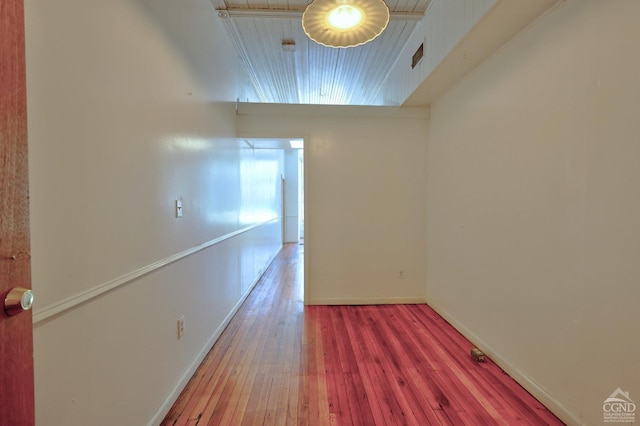 empty room with hardwood / wood-style flooring